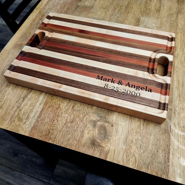 Striped cutting board with logo inlay